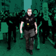 A Detroit police officer walks through demonstrators during protests on May 29, 2020. The badge on his chest, depicting Frank Castle’s Punisher skull on a green field alongside the words “Detroit Police,” is one of several designs using the imagery spotted on Detroit PD officers during recent protests.